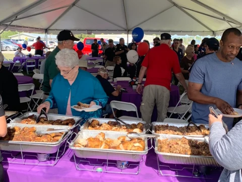 Guests being served a meal at a 5 Loaves & 2 Fish event